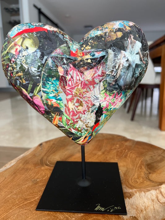 Mixed media heart sculpture with vibrant colors and intricate textures 