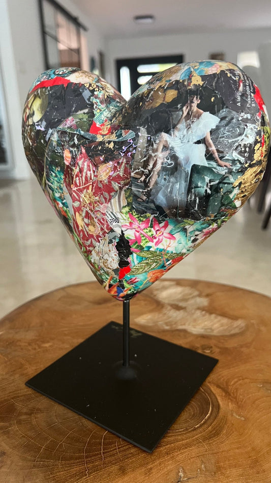 Heart sculpture with a vibrant collage featuring elegance and sophistication