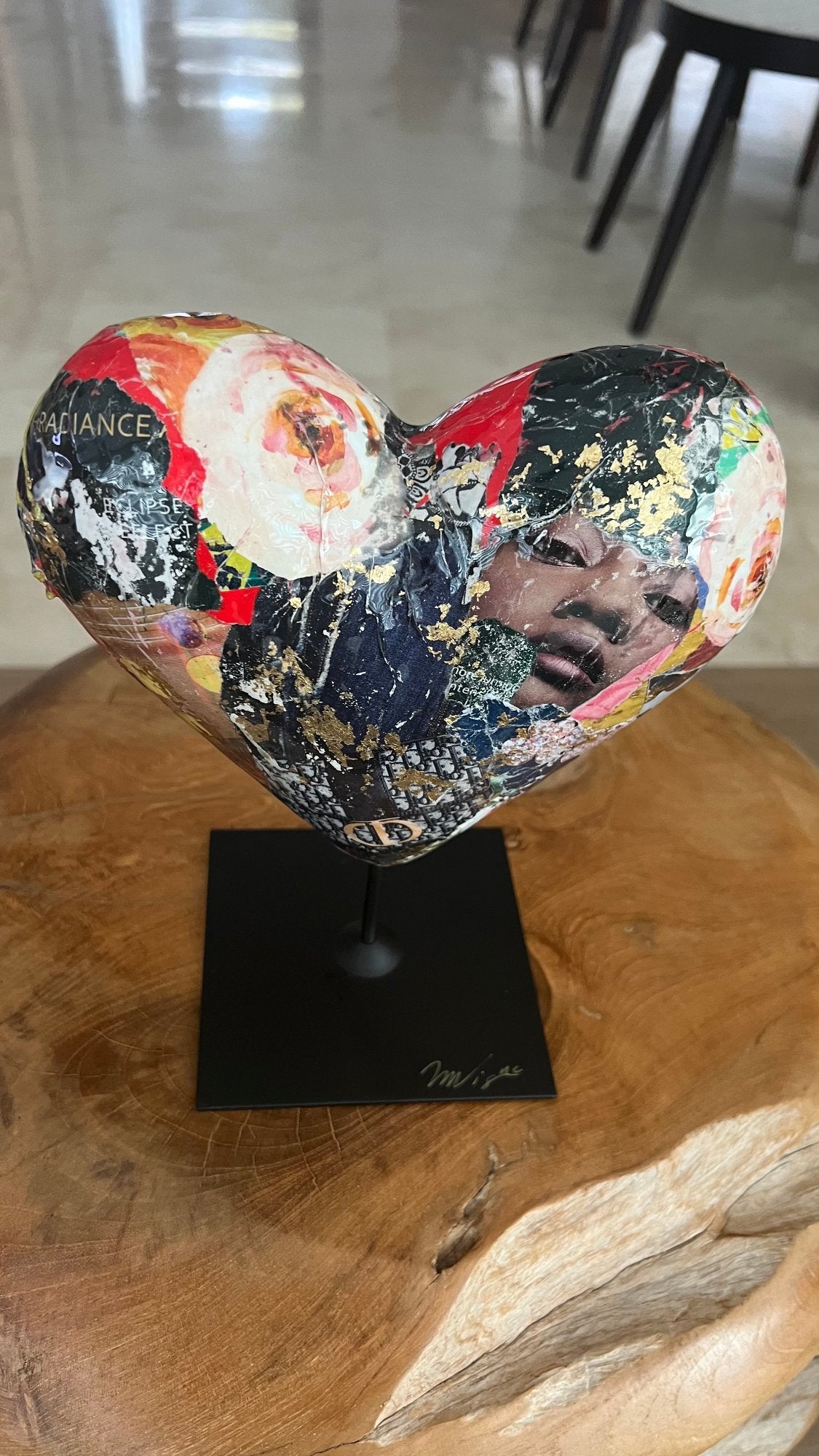 Artistic heart sculpture with gold leaf and textured collage details