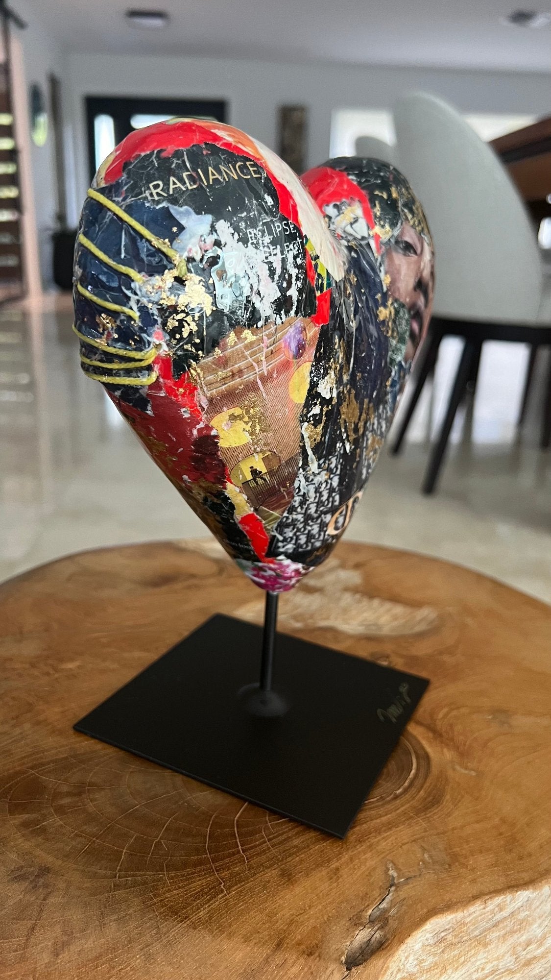 Multicolor heart sculpture with abstract patterns and 'Love' inscription