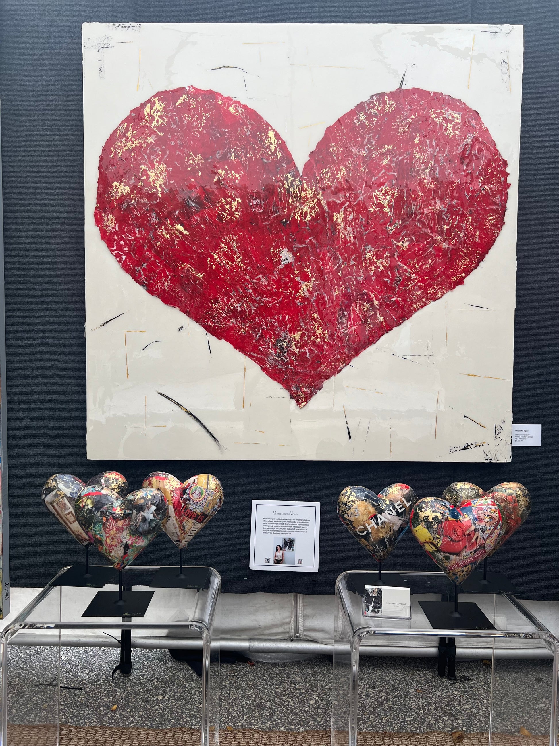 Exquisite handcrafted heart mini sculpture featuring a unique blend of mixed media collage and resin. Crafted with styrofoam, gesso, collage, and resin, measuring 8.5" in length and 8" in width. Elevate your space with this carefully designed piece.